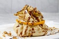 Fried pancake with orange and nuts