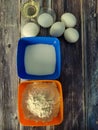 Fried pancakes, wheat flour, milk, chicken eggs, vegetable oil, salt and sugar on a wooden table.  Ingredients for fried pancakes Royalty Free Stock Photo