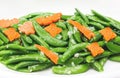 Fried pea and carot with garlic on white, vegetarion healthy foo