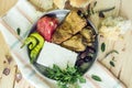 Fried peppers, bulgarian brined cheese,in an old metal plate