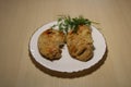 Fried pieces of chicken in a plate on the table. Royalty Free Stock Photo