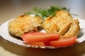 Fried pieces of chicken in a plate on the table. Royalty Free Stock Photo