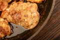 Fried pieces of meat in a frying pan, close-up, selective focus Royalty Free Stock Photo