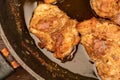 Fried pieces of meat in a frying pan, close-up, selective focus Royalty Free Stock Photo