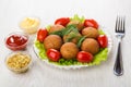 Fried pies stuffed with meat, lettuce, tomatoes, bowls with sauces Royalty Free Stock Photo