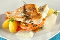 Fried pike perch fillet with vegetables.