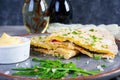 Fried pita bread with scrambled eggs, tomatoes, meat and cheese. Stuffed lavash Royalty Free Stock Photo