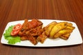 Fried plantains and gizzard stew with fresh tomatoes - Nigerian food - Delicacy Royalty Free Stock Photo