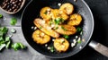 Fried plantains in pan with black beans and fresh cilantro garnish Royalty Free Stock Photo