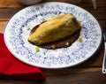 Fried poblano chili with egg and stuffed with meat