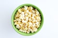 Fried popcorn in green bowl. White background Royalty Free Stock Photo