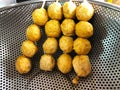 Fried pork balls and skewers are placed on the grill Royalty Free Stock Photo