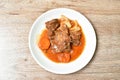 Fried pork bone with slice carrot and onion with swet and sour sauce on plate Royalty Free Stock Photo