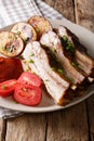 Fried pork brisket with baked potatoes on a plate close-up. Vert Royalty Free Stock Photo