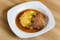 Fried pork chop in Japanese rice omelets also known as Omurice Royalty Free Stock Photo