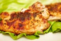 Fried pork chop steak on a lettuce leaf