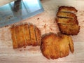 Fried pork cut into pieces on a wooden chopping board