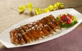 Fried pork ribs with broccoli on white plate in restaurant Royalty Free Stock Photo