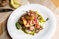 Fried potato with bacon and green beans on plate over wooden background. selective focus Royalty Free Stock Photo