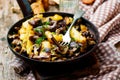 Fried potato with mushrooms in a vintage frying pan Royalty Free Stock Photo