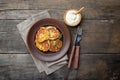 Fried potato pancakes - draniki or deruny on a wooden table. Rustic style. Royalty Free Stock Photo