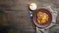 Fried potato pancakes - draniki or deruny on a wooden table. Rustic style. Royalty Free Stock Photo