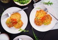 Fried potato pancakes with red caviar and sour cream fritter roesti.