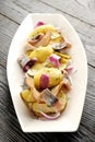 Fried potato and pickled herring Royalty Free Stock Photo
