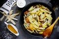 Fried potatoes in a black frying pan Royalty Free Stock Photo