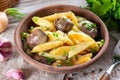 Fried potatoes with chicken liver in a ceramic bowl on a table Royalty Free Stock Photo