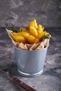 Fried potatoes country style. Barbecue potatoes. In a metallic bowl on a gray background Copy space Vertical Royalty Free Stock Photo