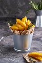 Fried potatoes country style. Barbecue potatoes. In a metallic bowl on a gray background Copy space Vertical Royalty Free Stock Photo