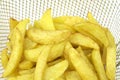Fried potatoes in deep fryer Royalty Free Stock Photo