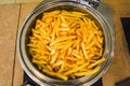 Fried potatoes in deep fryer Royalty Free Stock Photo