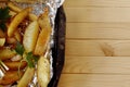 Fried potatoes in foil from oven