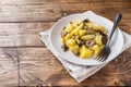 Fried potatoes with mushrooms and onions. Wooden table Copy sapce