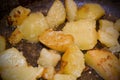 Fried potatoes in a pan with a golden brown mineral coating in vegetable oil. close-up photo