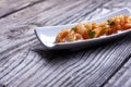 Fried prawns in a black plate