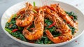 Fried prawns or shrimps with spinach, chili and garlic in white plate Royalty Free Stock Photo
