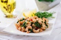 Fried prawns or shrimps with spinach, chili and garlic in white plate. Royalty Free Stock Photo