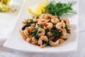 Fried prawns or shrimps with spinach, chili and garlic in white plate. Royalty Free Stock Photo