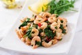 Fried prawns or shrimps with spinach, chili and garlic in white plate. Royalty Free Stock Photo