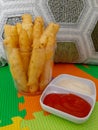 Fried processed potato snack ready to eat with ketchup and mayonnaise