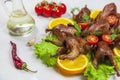 Fried quail in the orange with tomato and fresh parsley and spices Royalty Free Stock Photo