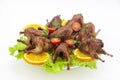 Fried quail in the orange with tomato and fresh parsley and spices Royalty Free Stock Photo