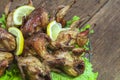 Fried quail in the orange with tomato and fresh parsley and spices Royalty Free Stock Photo