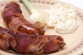FRIED RED SAUSAGES BACON SERVED CHICKEN SALAD ONION Royalty Free Stock Photo