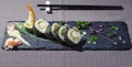 Fried red shrimp in tempura wrapped in rice with seaweed nori and salad Royalty Free Stock Photo