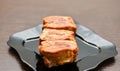 Fried ribs on the black plate Royalty Free Stock Photo