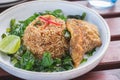 Fried rice with basil and crispy fried fish sliced, Thai food Royalty Free Stock Photo